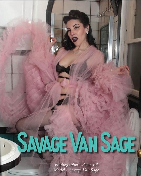 Female model wearing black lingerie and pink robe in vintage-style bathroom