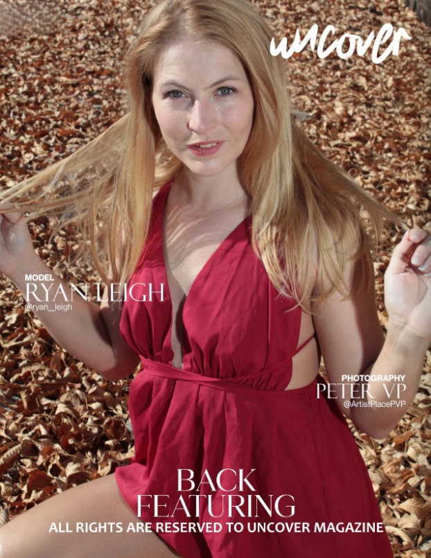 Female model sitting on a pile of leaves
