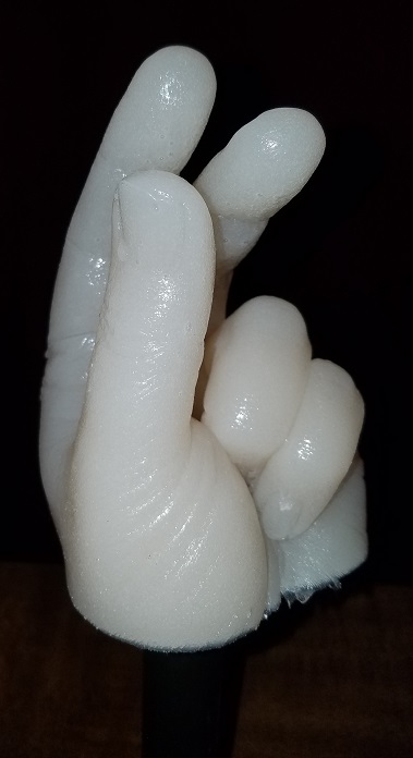 closeup front view of cast hand