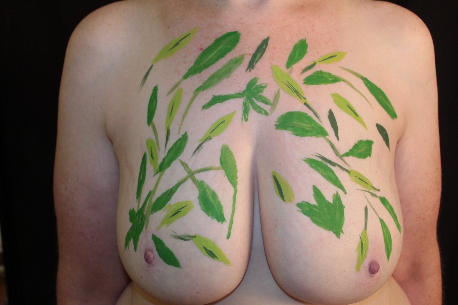Body painted leaves on female model