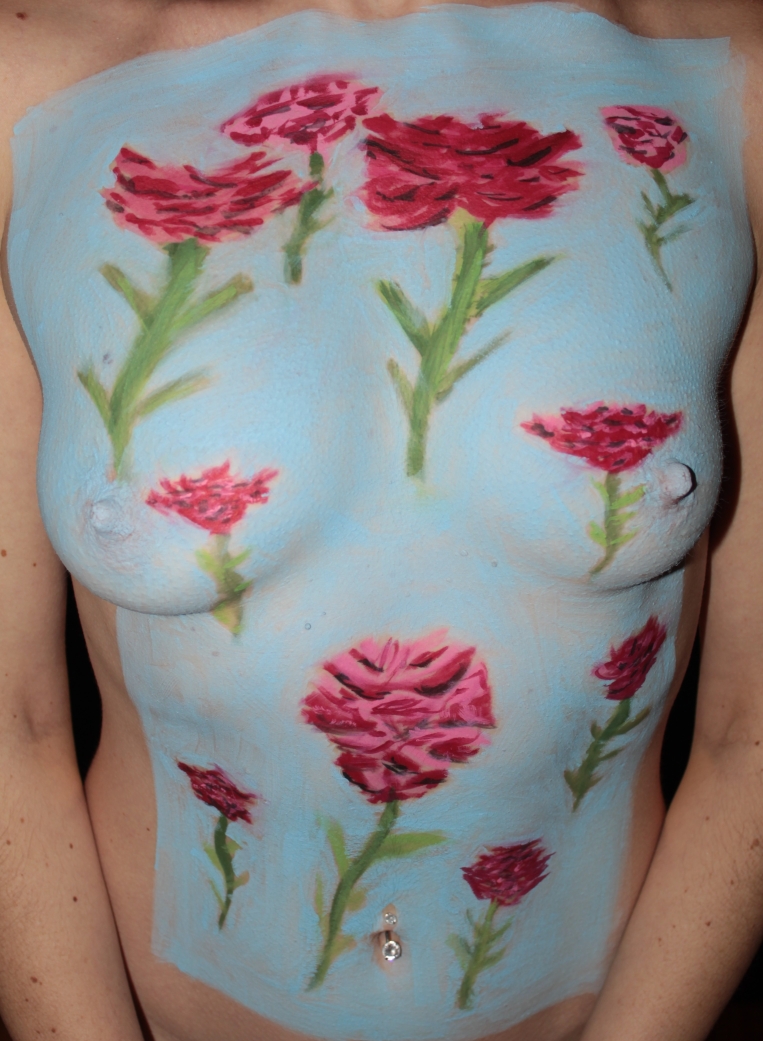 Close up of Female torso body painted with roses