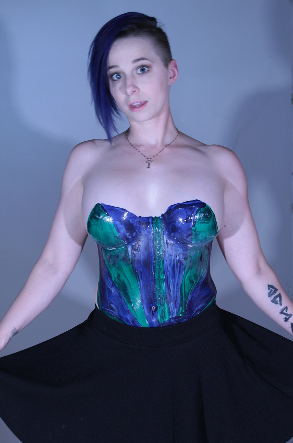 female torso body painted Green and Purple laytex top